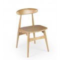 Moderná škandinávska jedálenská stolička Sika z masívneho dreva sungkai v svetlej hnedej farbe s oválnou opierkou na chrbát