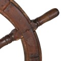 Dizajnová vintage nástenná dekorácia Rudder s motívom lodného kormidla z tmavého hnedého dreva s kovovým detailom 105 cm