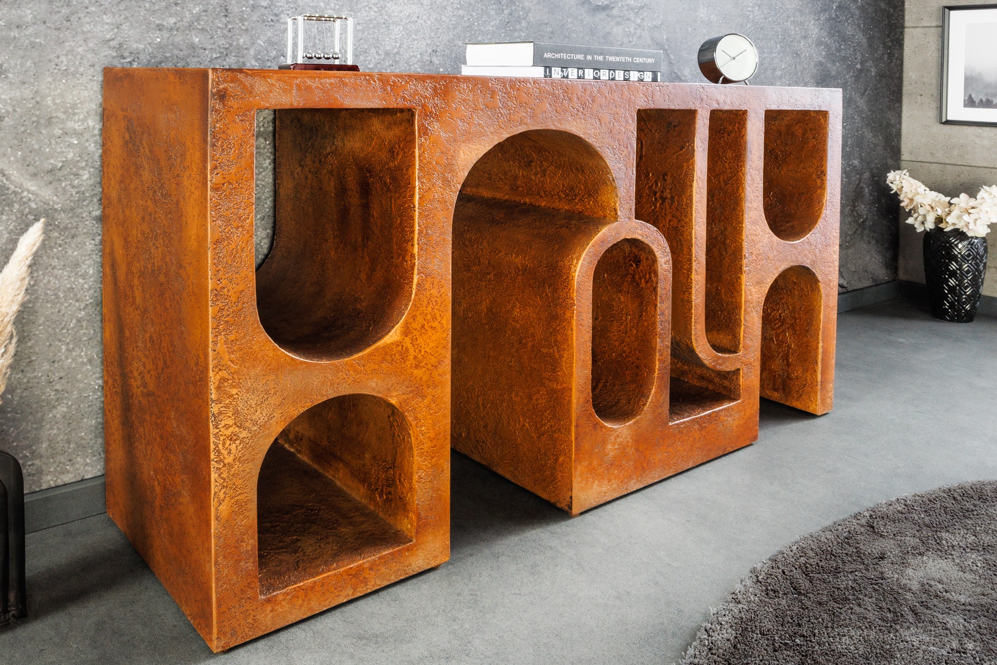 Estila Dizajnový art deco konzolový stolík Gerin s geometrickými výrezmi v medenej farbe 120 cm
